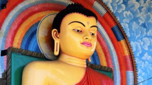 Colorful bust of a large Buddha statue.