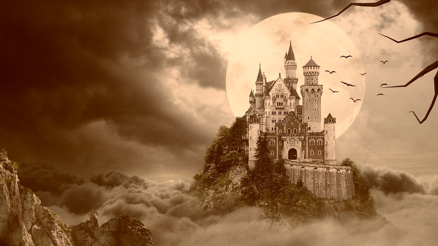 Castle in front of a full moon.
